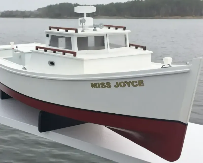 Model workboat personalized with the name MISS JOYCE on the bow